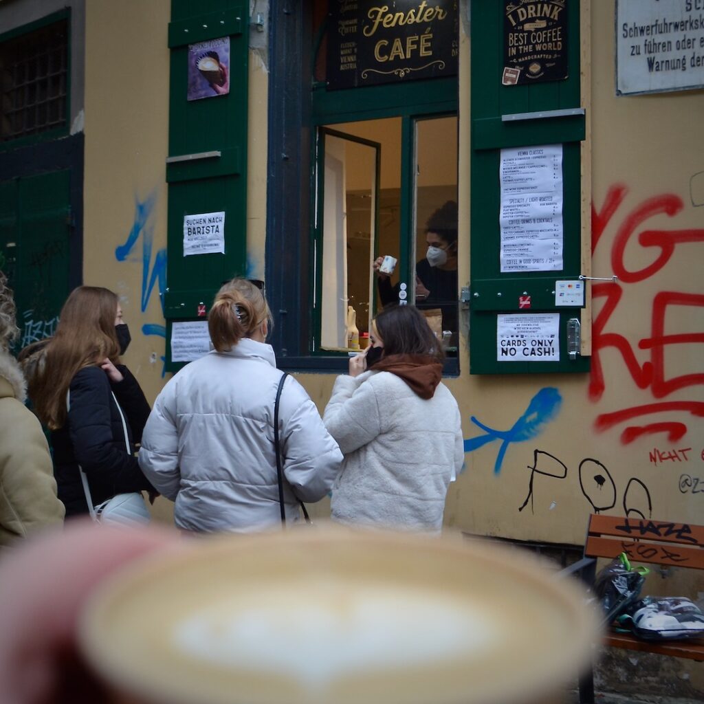 A Couple of friends are waiting to became their Cornettocino at Fenster Cafe in Vienna